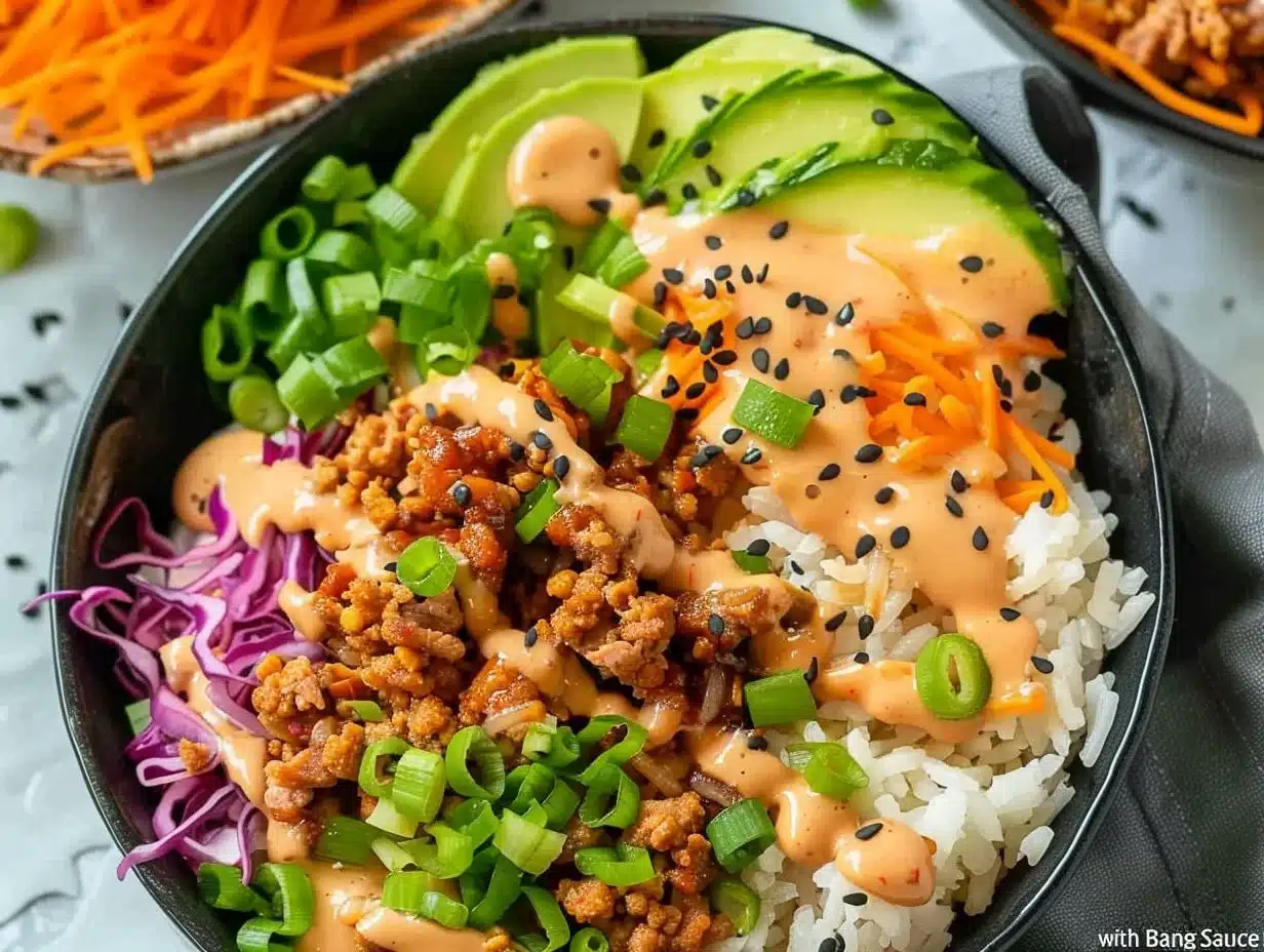 Ground Turkey Rice Bowls with Bang Bang Sauce 1 Ground turkey rice bowls topped with Bang Bang sauce, served in a vibrant bowl.