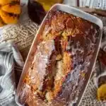 Freshly baked banana bread on a wooden cutting board