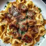 Cracked Garlic Steak Tortellini served in creamy sauce with herbs.