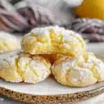 Freshly baked lemon crinkle cookies dusted with powdered sugar