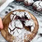 Delicious chocolate crinkle cookies dusted with powdered sugar, fresh from the oven.